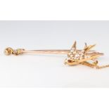 An Edwardian yellow metal 15ct seed pearl swallow brooch 30mm together with a yellow metal diamond