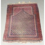 A blue and red ground Afghan prayer rug with multi row border 145cm x 110cm In wear, fringing to