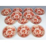 Twelve 19th Century ochre Imari pattern dessert plates 22cm (5 a/f)