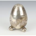 A Victorian silver ovoid shaped shaker on ball feet, London 1876, 81 grams, 8cm There are minor