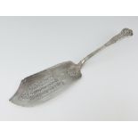 A William IV silver Kings pattern fish slice with pierced decoration and engraved monogram, London