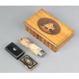 An olive wood trinket box in the form of book containing a hare's pad, a Victorian black lacquered