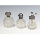 A Victorian silver mounted cut glass scent London 1888 10cm, ditto 11cm, an atomiser 12cm Both