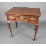 An 18th Century oak side table, the top formed of 3 planks with dentil cornice to the front,