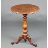 A 19th Century circular mahogany wine table with dish style stop, raised on bulbous turned column