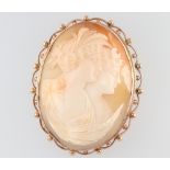 A yellow metal 9ct mounted double portrait cameo brooch 50mm x 40mm