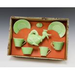 A Wade Heath Donald Duck 7 piece green glazed dolls tea service comprising teapot (lid chipped), 2