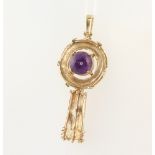 A yellow metal stamped 333 stylish gold pendant with with a cabochon amethyst 8.6 grams 5cm