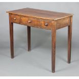 A 19th Century rectangular oak side table fitted 1 long and 2 short drawers, raised on square