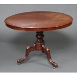 A Victorian circular snap top breakfast table, raised on a pillar and tripod base 71cm h x 102cm