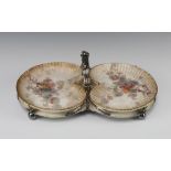 A circular silver plated twin handed dish frame with 2 associated Doulton Burslem scallop shaped