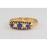 An 18ct yellow gold sapphire and diamond ring, size R 1/2, 5.2 grams