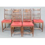 A set of 6 oak Aesthetic movement stick and rail back dining chairs with woven cane drop in seats