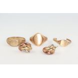 A 9ct yellow gold signet ring size R, a ditto size T 1/2, a cut ditto and a pair of ear studs 10.9