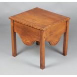 A 19th Century rectangular oak commode with hinged lid and shaped apron, raised on square supports