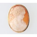A yellow metal mounted portrait cameo brooch 55mm x 40mm