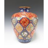 A 20th Century Japanese Imari oviform vase with panel decoration 35cm