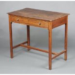 An 18th Century oak side table, the top formed of 3 planks fitted a drawer, raised on square