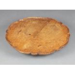 A 1920's Georgian style circular oak lazy Susan with pie crust edge 12cm x 55cm diam. The top is