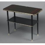 A mid-century 'atomic' pattern rectangular ebonised and gilt painted glass 2 tier occasional table