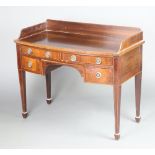 A 19th Century inlaid mahogany bow front dressing table with 3/4 gallery, 2 long drawers above 2