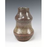 An Art Pottery double gourd shaped brown glazed vase with incised geometric decoration 19cm