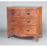 A 19th Century inlaid mahogany bow front chest of 2 short and 2 long drawers, raised on bracket feet