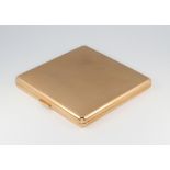 A 9ct yellow gold engine turned square cigarette case, gross 93.4 grams, Birmingham 1929
