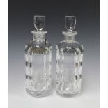 A pair of Orrefors panel cut decanters and stoppers, base marked Orrefors P2508-11, 28cm, 1 with a
