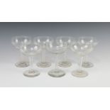 A near set of 7 champagne coupes with hollow stems 1 has small chip to base