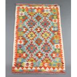 A white, brown, green and orange ground Chobi Kilim rug 127cm x 78cm