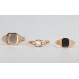 A gentleman's 9ct yellow gold hardstone set ring size J, a gold signet ring size V and a lady's