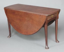 A Georgian mahogany oval drop flap dining table, fitted a frieze drawer, raised on club supports