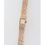 A lady's 9ct yellow gold Bueche-Girod wristwatch on a bark finished bracelet 25.2 grams including