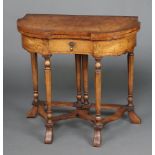 Gil and Reigate of London, a Queen Anne style figured walnut card table of crescent form, fitted a