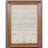 19th Century sampler with alphabets and verse with animals, trees and a crown 38cm x 26cm This