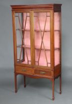 An Edwardian inlaid mahogany bookcase with moulded cornice, fitted shelves enclosed by astragal