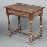A Victorian rectangular carved oak side table fitted a drawer, on turned and block supports with H