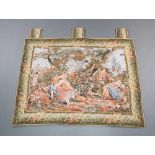 A machine made tapestry panel with seated figures 110cm x 84cm