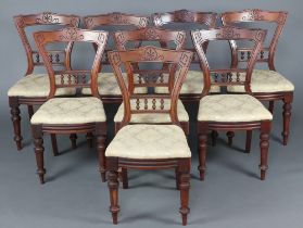 A set of 8 Victorian carved walnut bar back dining chairs, the mid rail with bobbin turned