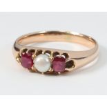 A Victorian yellow metal pearl and ruby ring, size N, 3.4g