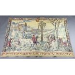 A 17th Century style machine made tapestry panel depicting mountain scene with castle, towers,