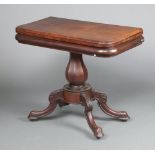 A Victorian D shaped mahogany tea table raised on turned column and tripod base 77cm h x 90cm w x