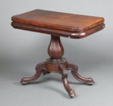 A Victorian D shaped mahogany tea table raised on turned column and tripod base 77cm h x 90cm w x