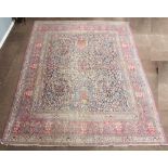A North Persian blue and white patterned floral carpet with multi row border 384cm x 298cm In wear