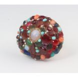 A yellow metal 9ct cluster gem set ring comprising opals, emeralds, turquoise, coral, sapphires,