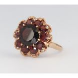 A 9ct yellow gold garnet cluster ring 5.3 grams size T 1/2