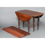 A 19th Century Continental drop flap mahogany dining table, raised on 6 turned and reeded