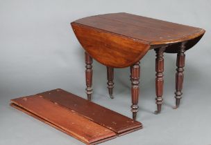A 19th Century Continental drop flap mahogany dining table, raised on 6 turned and reeded