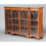 A 19th Century mahogany triple breakfront bookcase fitted shelves enclosed by arch shaped astragal